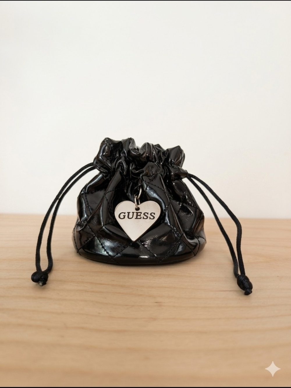 GUESS Black Quilted Patent Drawstring Pouch with Heart Charm